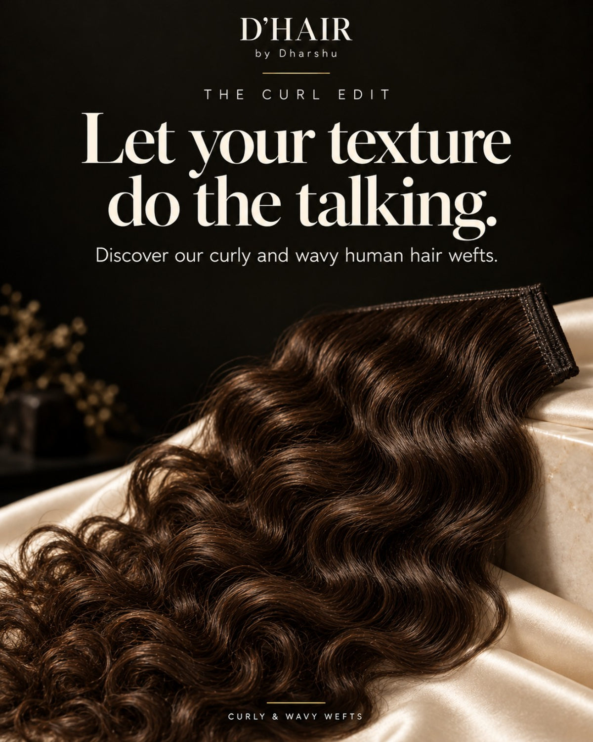 Curly and wavy human hair wefts on ivory fabric.